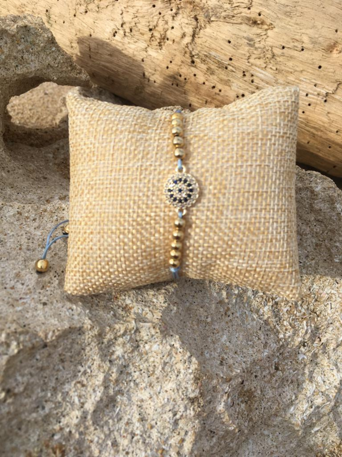 Light Blue Adjustable beaded bracelet with crystal details.