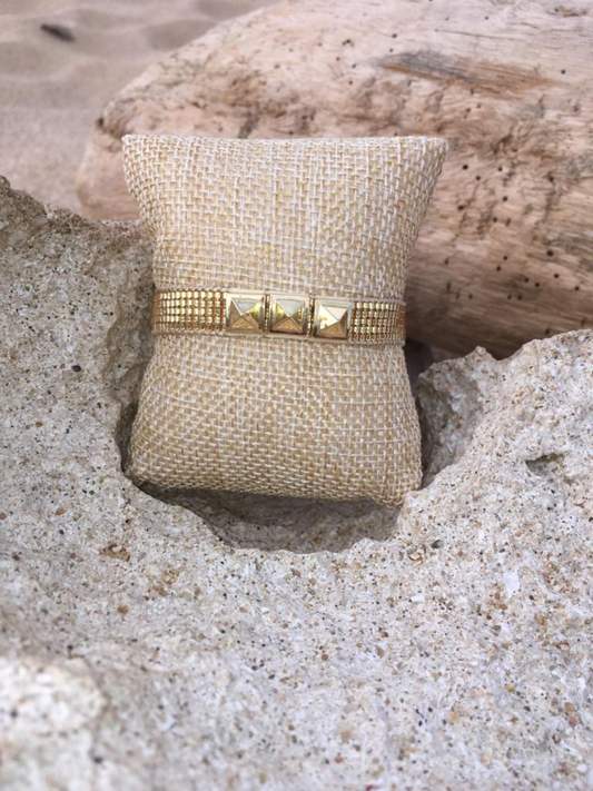 Adjustable gold beaded Bracelet with metal details.